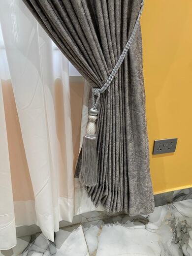 Curtains hung over a voile by KD Dream Space Designs