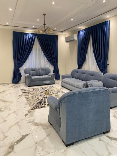 Curtains hung over a voile by KD Dream Space Designs