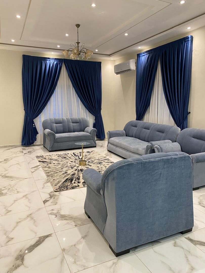 Curtains hung over a voile by KD Dream Space Designs