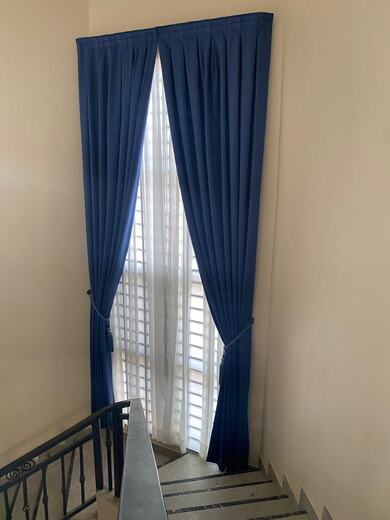 Curtains hung over a voile by KD Dream Space Designs