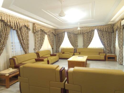 Curtains hung over a voile by KD Dream Space Designs