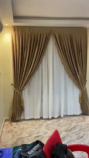 Curtains hung over a voile by KD Dream Space Designs