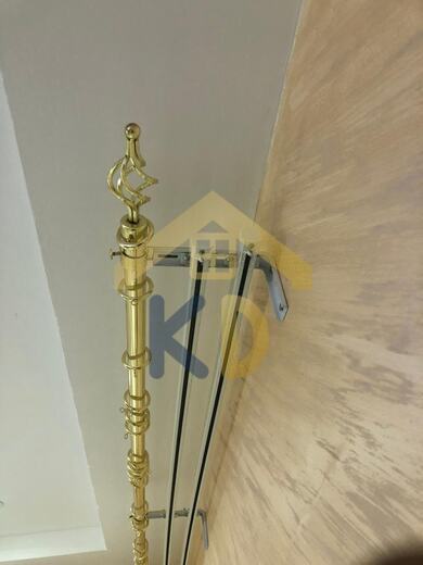 A curtain pole fitted by KD Dream Space Designs